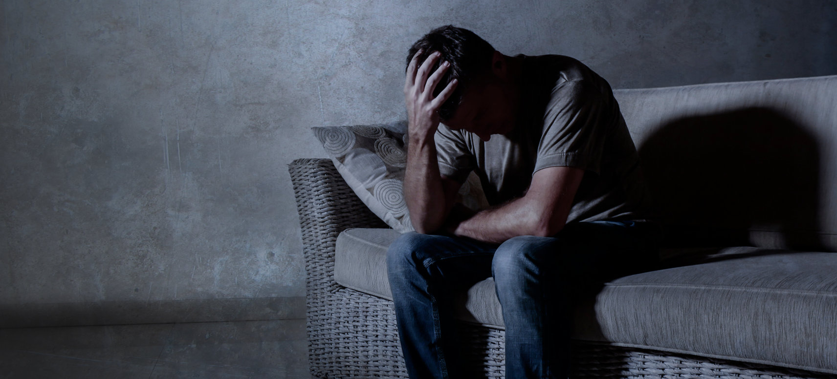 adult man in a dark room