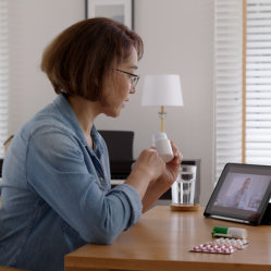 Woman taking her medicines