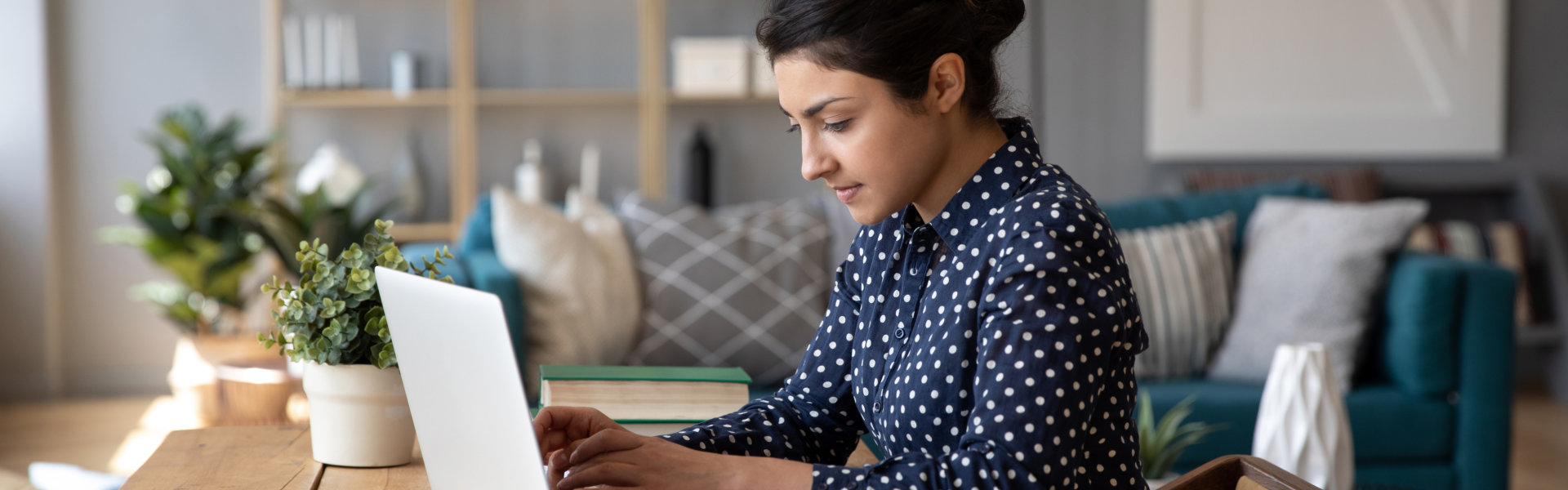 adult lady typing in her laptop